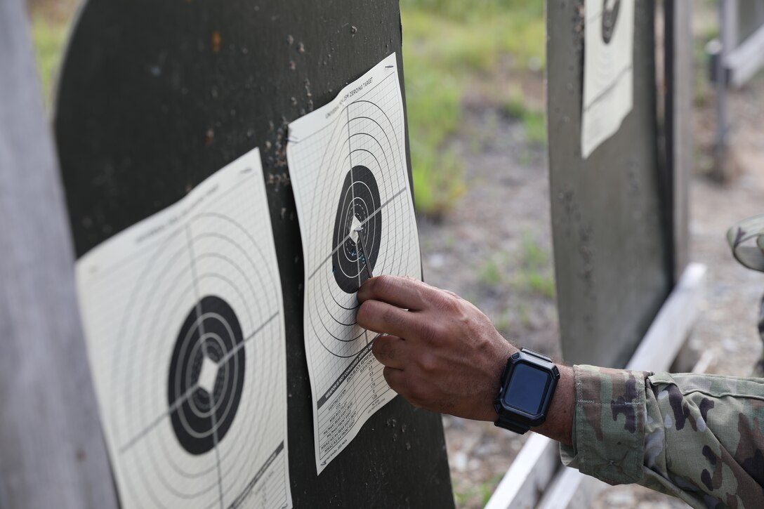 Army Reserve Soldiers assigned to Headquarters and Headquarters Detachment, 84th Training Command, receive feedback Aug. 7, 2021, during the zeroing process of rifle marksmanship qualification at Camby Hill Range in Fort Knox, Kentucky. (U.S. Army photo by Sgt. 1st Class Osvaldo P. Sanchez)