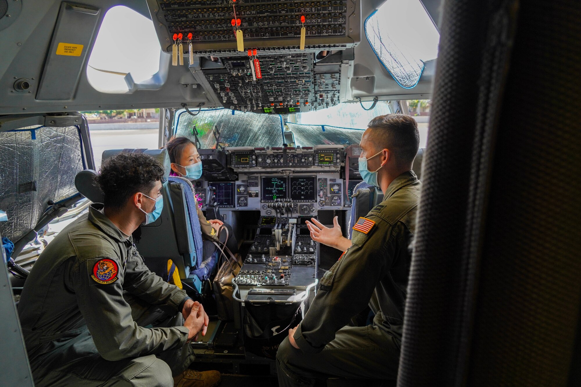 Serena Li, military liaison assistant to Congressman Kaiali’i Kahele, visits with Airmen from the 15th Wing at Joint Base Pearl Harbor-Hickam, Hawaii August 12, 2021. Kahele spoke with leaders, servicemembers and civilians regarding COVID-19 protocols, and readiness. (U.S. Air Force photo by Airman 1st Class Makensie Cooper)