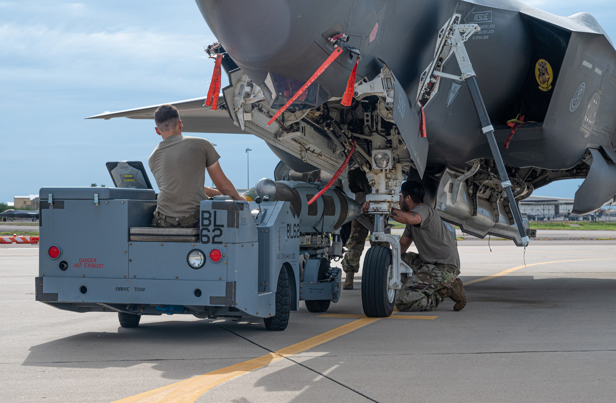 U.S. Air Force maintainers from the 61st Aircraft Maintenance Unit load a GBU-31 joint direct attack munition on an F-35A Lightning II Aug. 9, 2021, at Luke Air Force Base, Arizona.