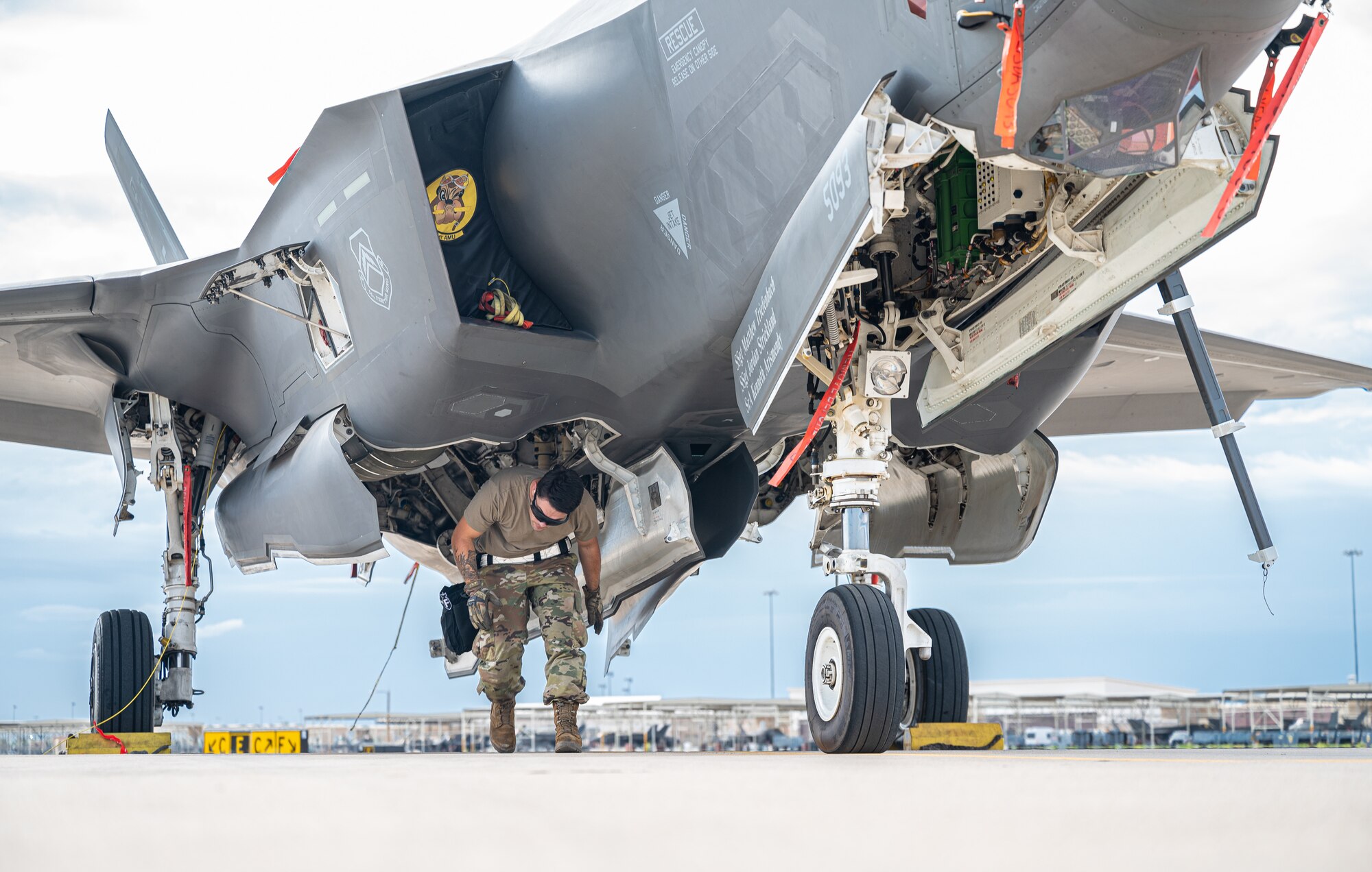 U.S. Air Force Airman 1st Class Justin Williams, 61st Aircraft Maintenance Unit maintainer, finishes loading a GBU-31 joint direct attack munition on an F-35A Lightning II Aug. 9, 2021, at Luke Air Force Base, Arizona.