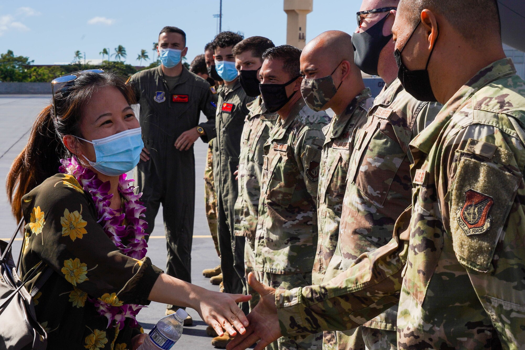 Serena Li, military liaison assistant to Congressman Kaiali’i Kahele, visits with Airmen from the 15th Wing at Joint Base Pearl Harbor-Hickam, Hawaii August 12, 2021. Kahele spoke with leaders, servicemembers and civilians regarding COVID-19 protocols, and readiness. (U.S. Air Force photo by Airman 1st Class Makensie Cooper)