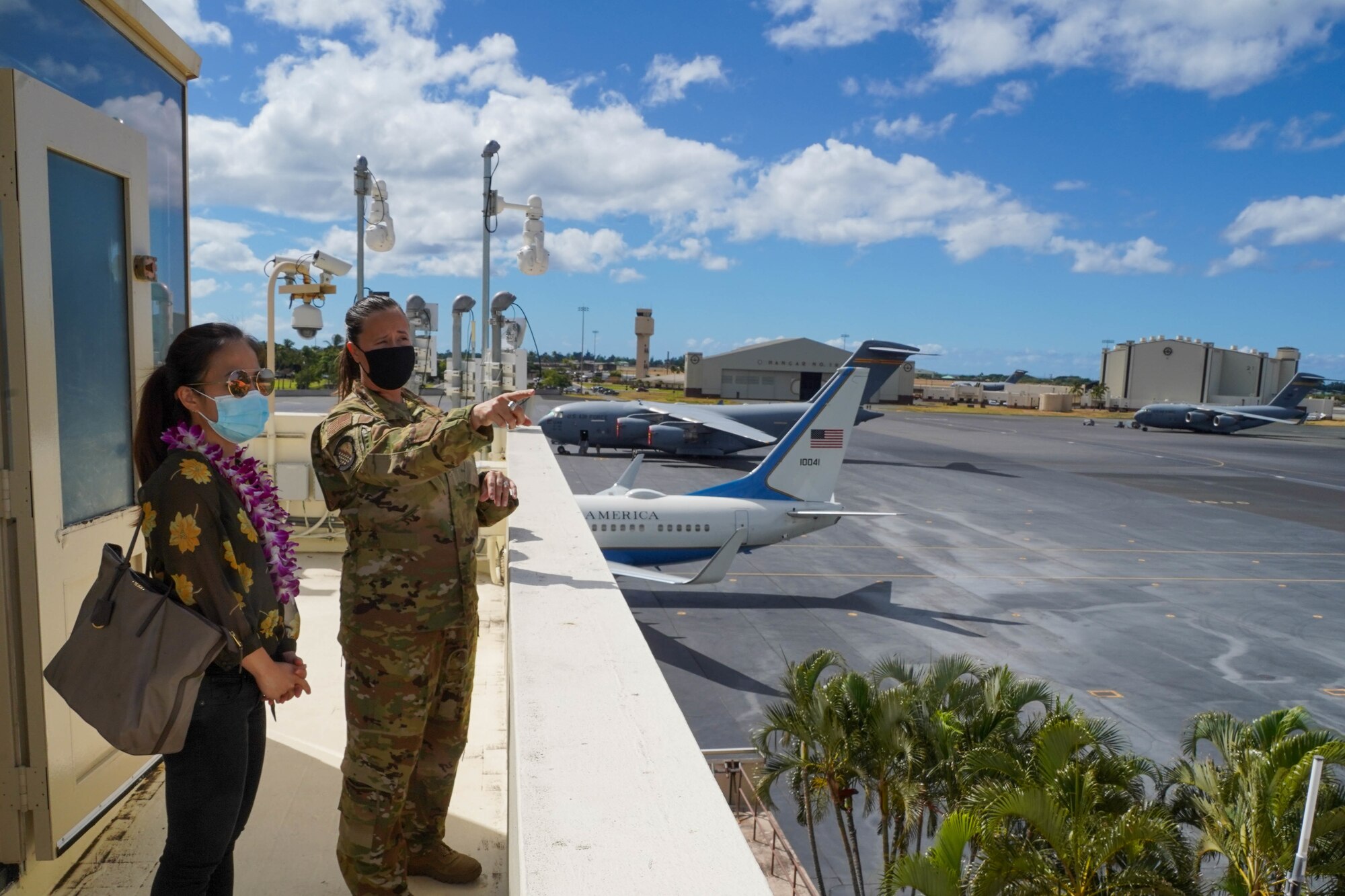 Serena Li, military liaison assistant to Congressman Kaiali’i Kahele, visits with Airmen from the 15th Wing at Joint Base Pearl Harbor-Hickam, Hawaii August 12, 2021. Kahele spoke with leaders, service-members and civilians regarding COVID-19 protocols, and readiness. (U.S. Air Force photo by Airman 1st Class Makensie Cooper)