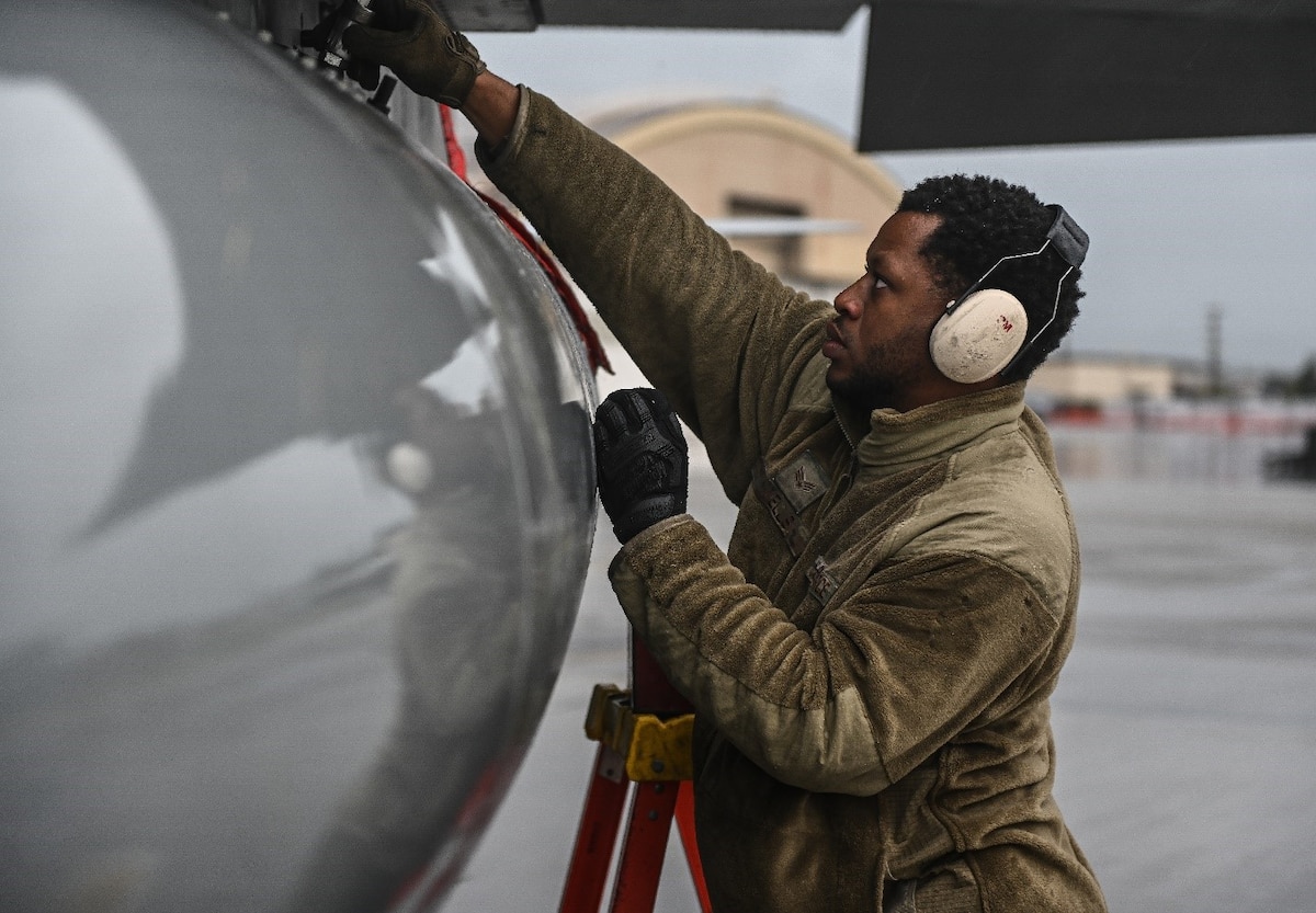 A U.S. Air Force Airman performs pre-flight checks on an F-16C Fighting Falcon ahead of a flying mission Aug. 16, 2021, at Eielson Air Force Base, Alaska. The flying mission was a part of Eielson AFB’s Red Flag exercise, pitting the F-16 against the F-35A Lightning II in a variety of air combat simulations. (U.S. Air Force photo by Staff Sgt. Christian Conrad)