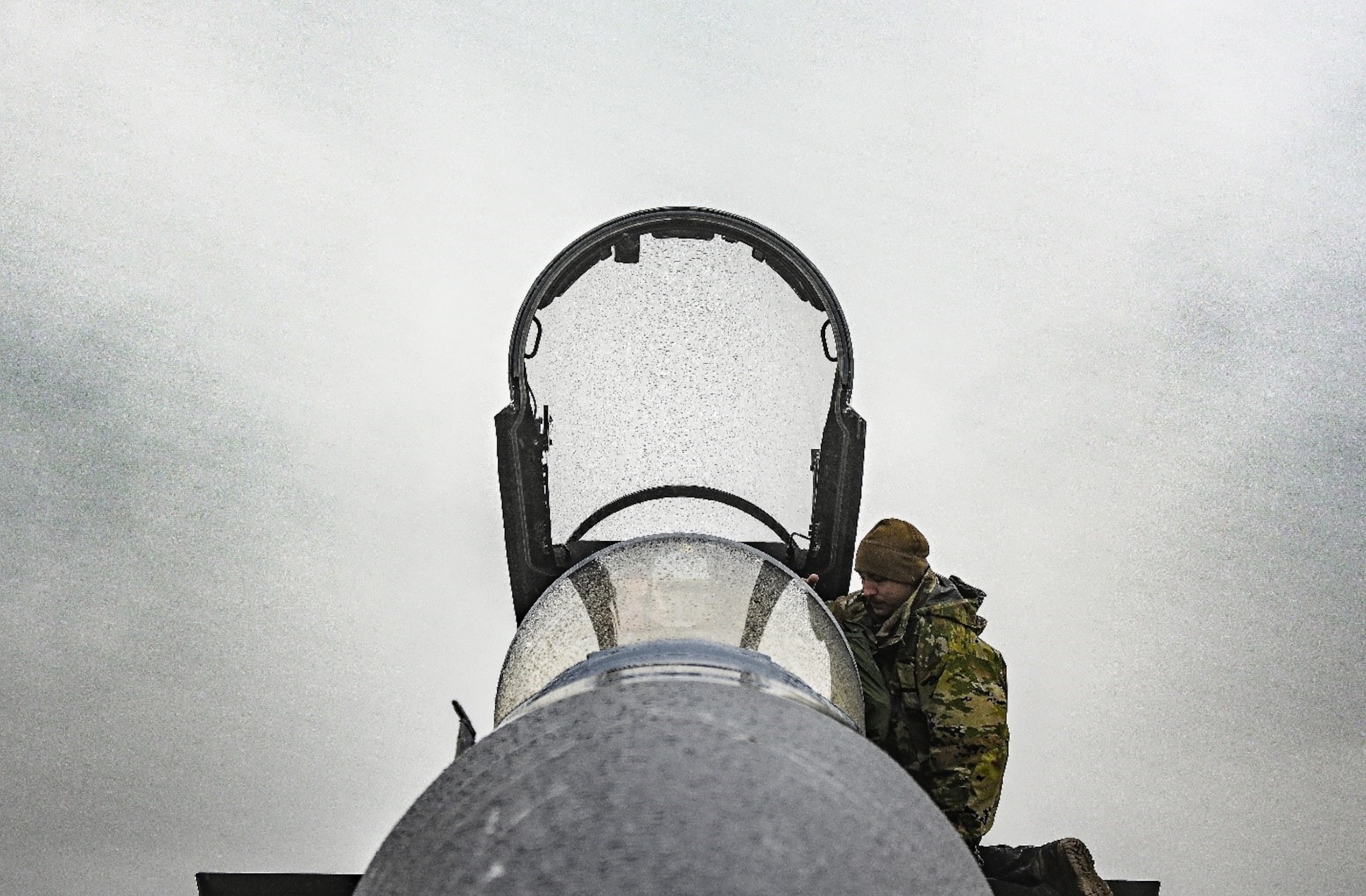 An Airman assigned to the 18th Aircraft Maintenance Squadron performs pre-flight checks on an F-35A Lightning II ahead of a flying mission Aug. 16, 2021, at Eielson Air Force Base, Alaska. The flying mission was part of a Red Flag exercise designed to test air combat tactics on fifth-generation aircraft. (U.S. Air Force photo by Staff Sgt. Christian Conrad)