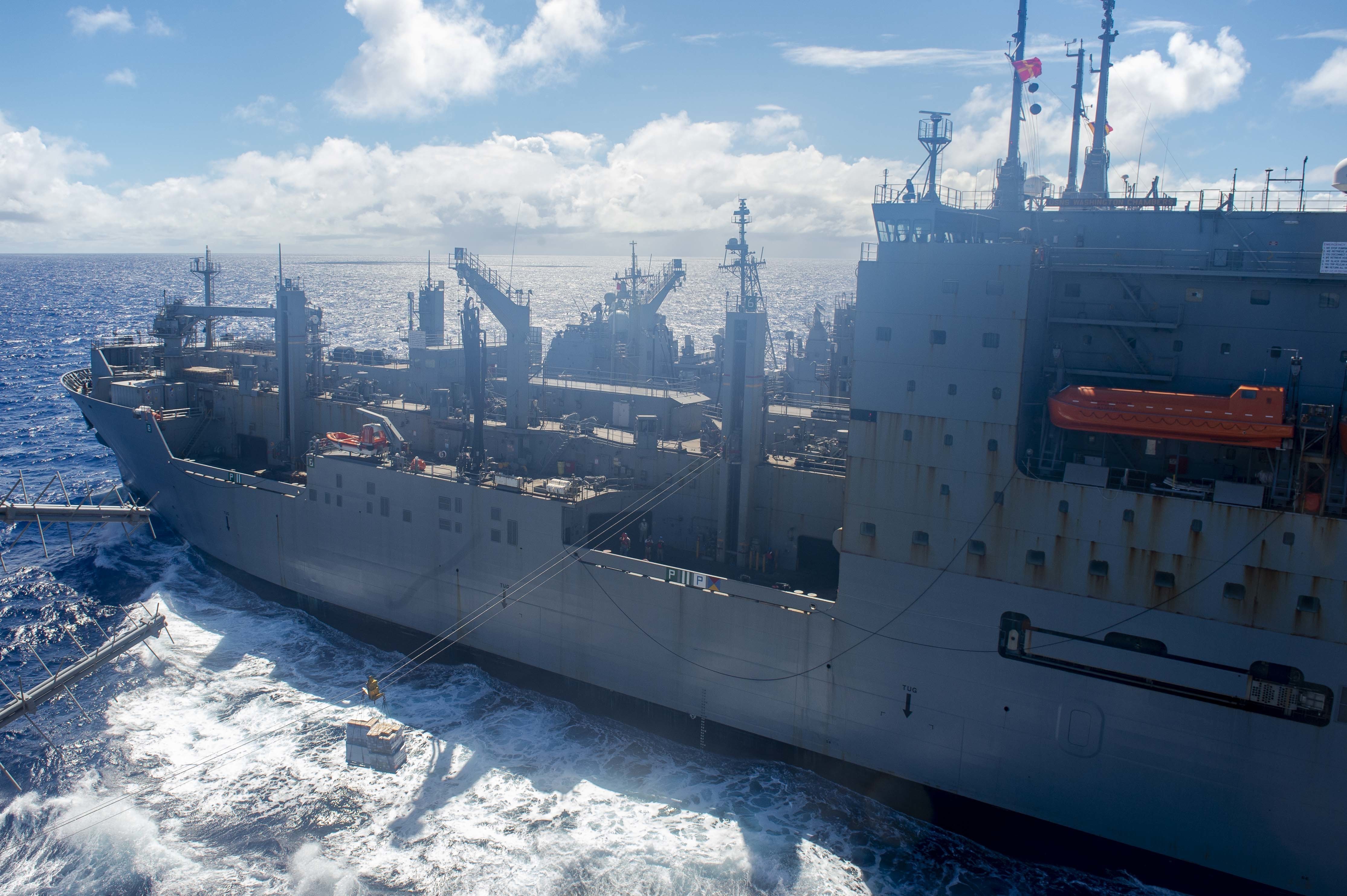 PACIFIC OCEAN (Aug. 13, 2021) The Louis and Clark-class Military Sealift Command dry cargo and ammunition ship USNS Washington Chambers (T-AKE 11) moves supplies to the Nimitz-class aircraft carrier USS Carl Vinson (CVN 70) during a replenishment-at-sea.