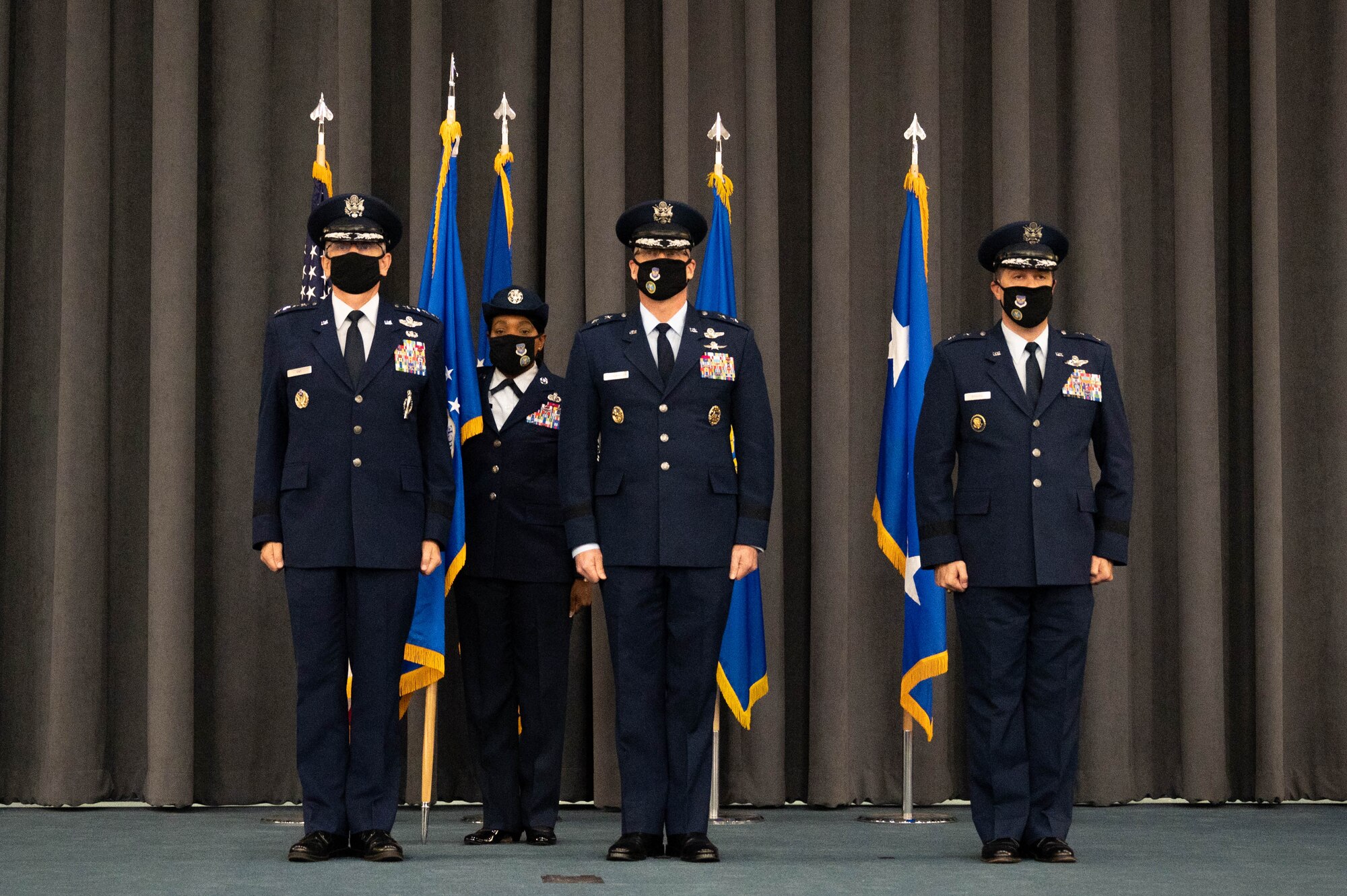 Gen. Tim Ray, left, commander of Air Force Global Strike Command, Lt. Gen. (select) Mark Weatherington, center, outgoing 8th Air Force and Joint-Global Strike Operations Center commander, and Maj. Gen. Andrew Gebara, incoming 8th Air Force and J-GSOC commander, stand at attention during  a change of command ceremony at Barksdale Air Force Base, La., August 16, 2021. A change of command is a military tradition that represents a formal transfer of authority and responsibility for a unit from one commanding or flag officer to another. (U.S. Air Force photo by Staff Sgt. Bria Hughes)