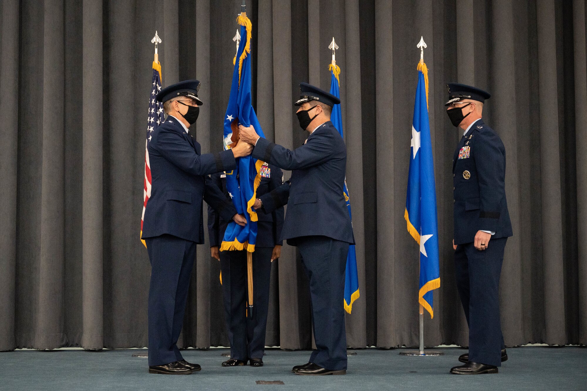 Maj. Gen. Andrew Gebara, center, incoming 8th Air Force and Joint-Global Strike Operations Center commander, receives the guidon from Gen. Tim Ray, commander of Air Force Global Strike Command, during a change of command ceremony at Barksdale Air Force Base, La., August 16, 2021. The passing of a unit’s guidon symbolizes a transfer of command. (U.S. Air Force photo by  Senior Airman Jovante Johnson)