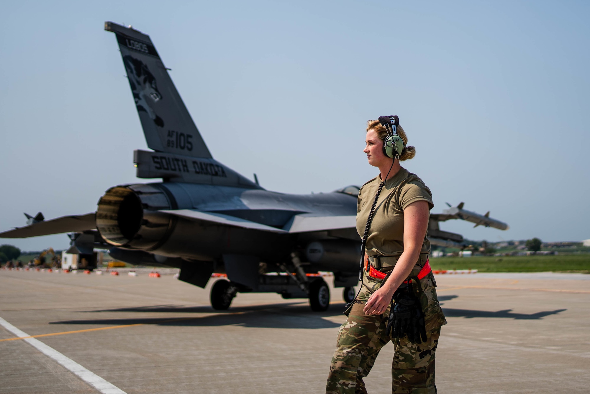 U.S. Air Force Staff Sgt. Mikayla Wilson, crew chief, 114th Aircraft Maintenance, South Dakota National Guard, goes through launch procedures during the readiness exercise Aug. 9, 2021, at Joe Foss Field, S.D. The readiness exercise is designed to enhance the warfighter ethos of mission-type orders, independent decision making, and risk management at the lowest competent level by testing the 114th Fighter Wing’s ability to set up an alert sight and generate combat airpower on short notice. (U.S. Air National Guard photo by Tech. Sgt. Duane Duimstra)