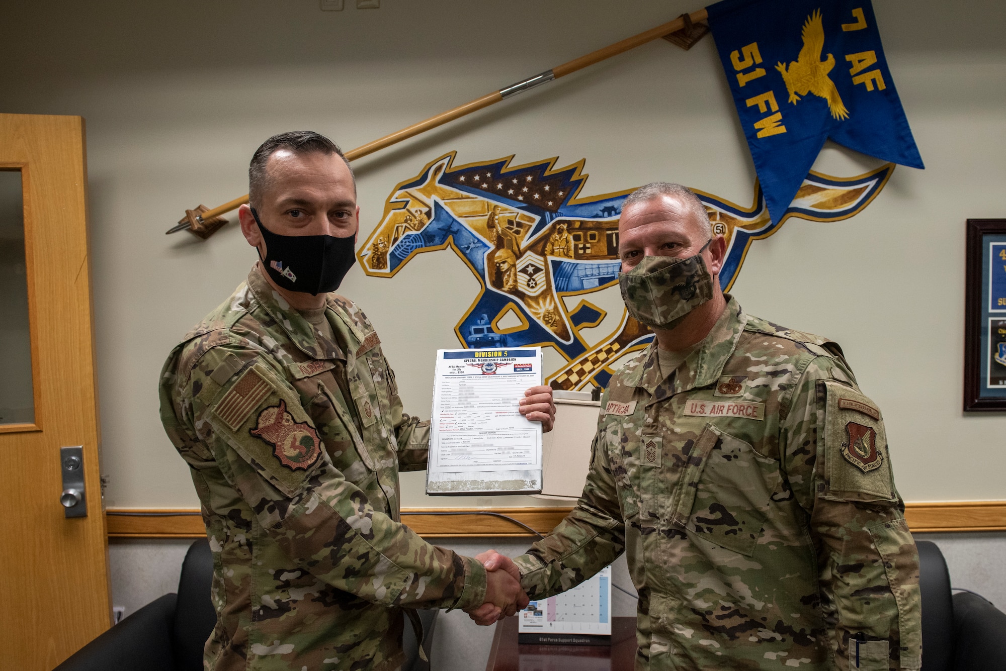 Chief Master Sgt. Justin Apticar,51st Fighter Wing command chief, signed up for a lifetime membership with the Air Force Sergeants Association at Osan Air Base, Republic of Korea, August 17, 2021.