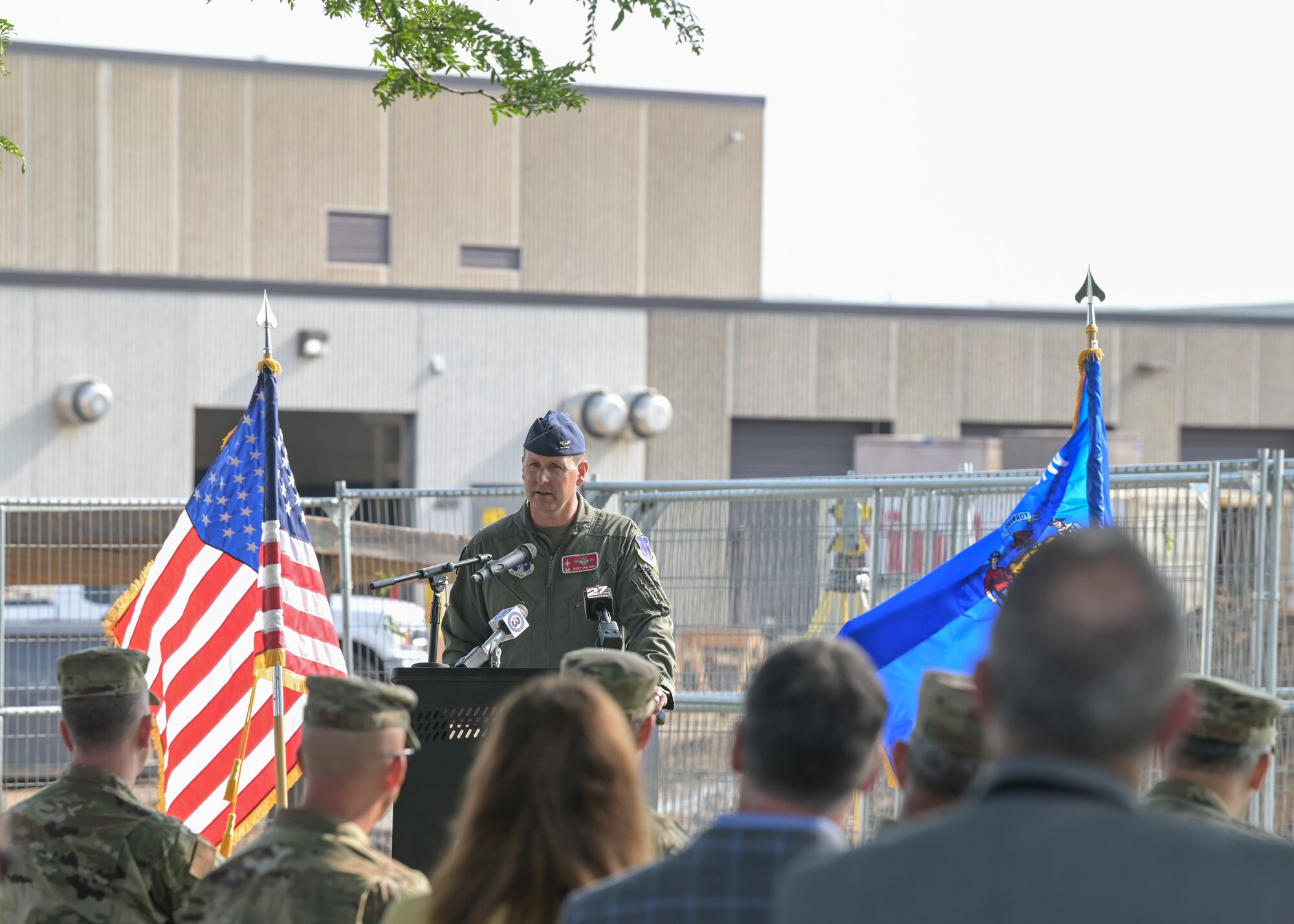 U.S. Air Force Col. Bart Van Roo, the commander of the 115th Fighter Wing, Truax Field, Madison, Wisconsin, presents the 115th Fighter Wings breaking ground ceremony Aug. 11, 2021 for its first F-35 Lightning II conversion project. The ceremony brought together military and civilian leadership to commemorate the future of the Madison unit as the selected beddown site of the F-35 Lightning II aircraft. (U.S. Air National Guard photo by Staff Sgt. Cameron Lewis)
