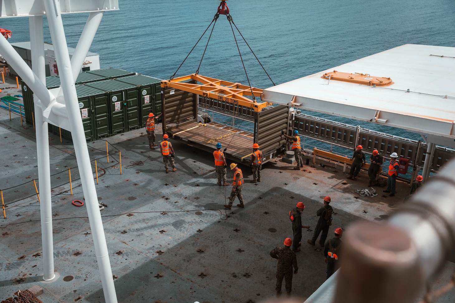 U.S. Marines with 1st Landing Support Battalion, 1st Marine Logistics Group and U.S. Navy Sailors from the USNS Dahl (T-AKR 312) offload equipment from the USNS Dahl (T-AKR 312)as part of Exercise Freedom Banner at Naval Base Guam Aug. 1, 2021.