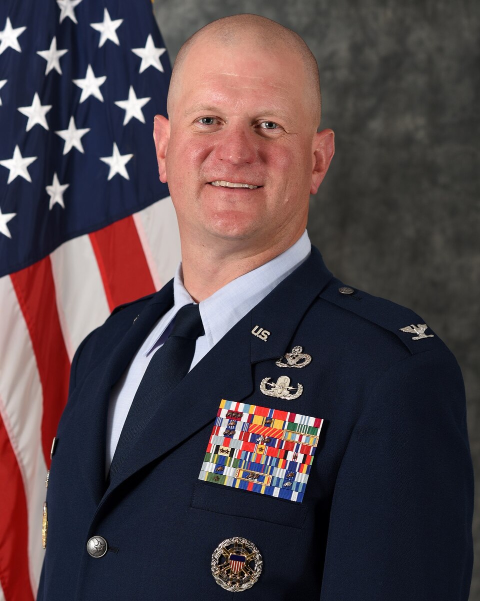 Colonel Joshua D. DeMotts is the Vice Commander, 99th Air Base Wing, Nellis Air Force Base, Nevada.  In this position, he supports the installation command authority for Nellis Air Force Base and the 2.9 million-acre Nevada Test and Training Range.  He is responsible for all installation support, providing communications, contracting, engineering, environmental, law enforcement, logistics, medical, security, services, supply, transportation and mission support for more than 12,000 assigned service members and 313,000 family members, retirees and veterans. In addition, the 99 ABW supports the United States Air Force Warfare Center, 53rd Wing, 57th Wing, 432nd Wing, 505th Command & Control Wing, 926th Wing, 363rd Intelligence, Surveillance and Reconnaissance Wing, the NTTR, 52 tenant units, over 250 fixed- and rotary-wing aircraft assigned to Nellis and nearly 1,500 visitors and temporary-duty personnel conducting business daily across the installation.