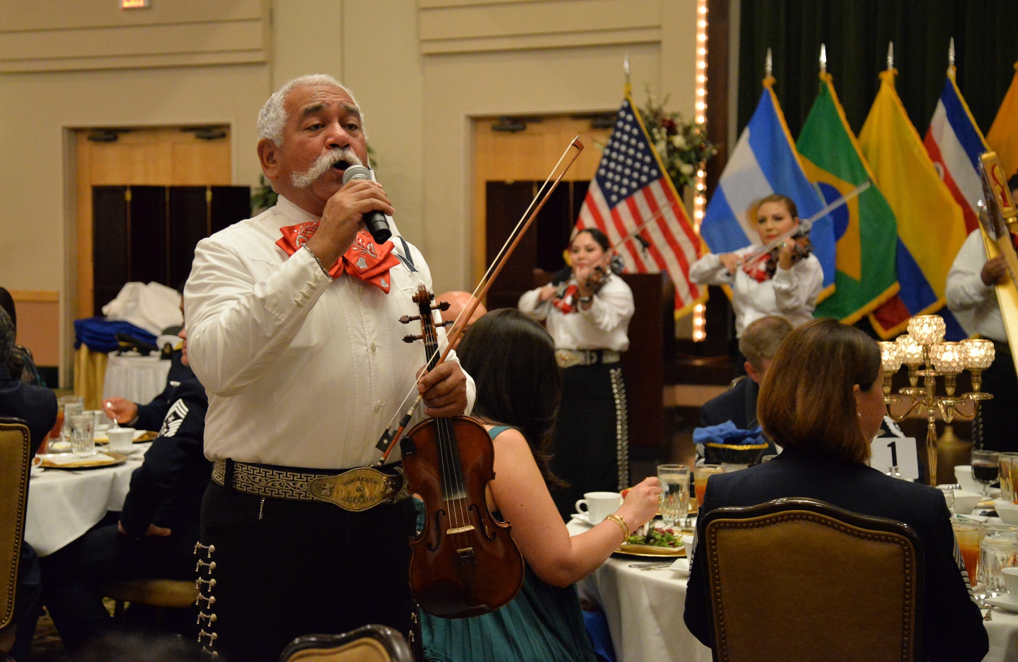 Mariachi group singing and performing.