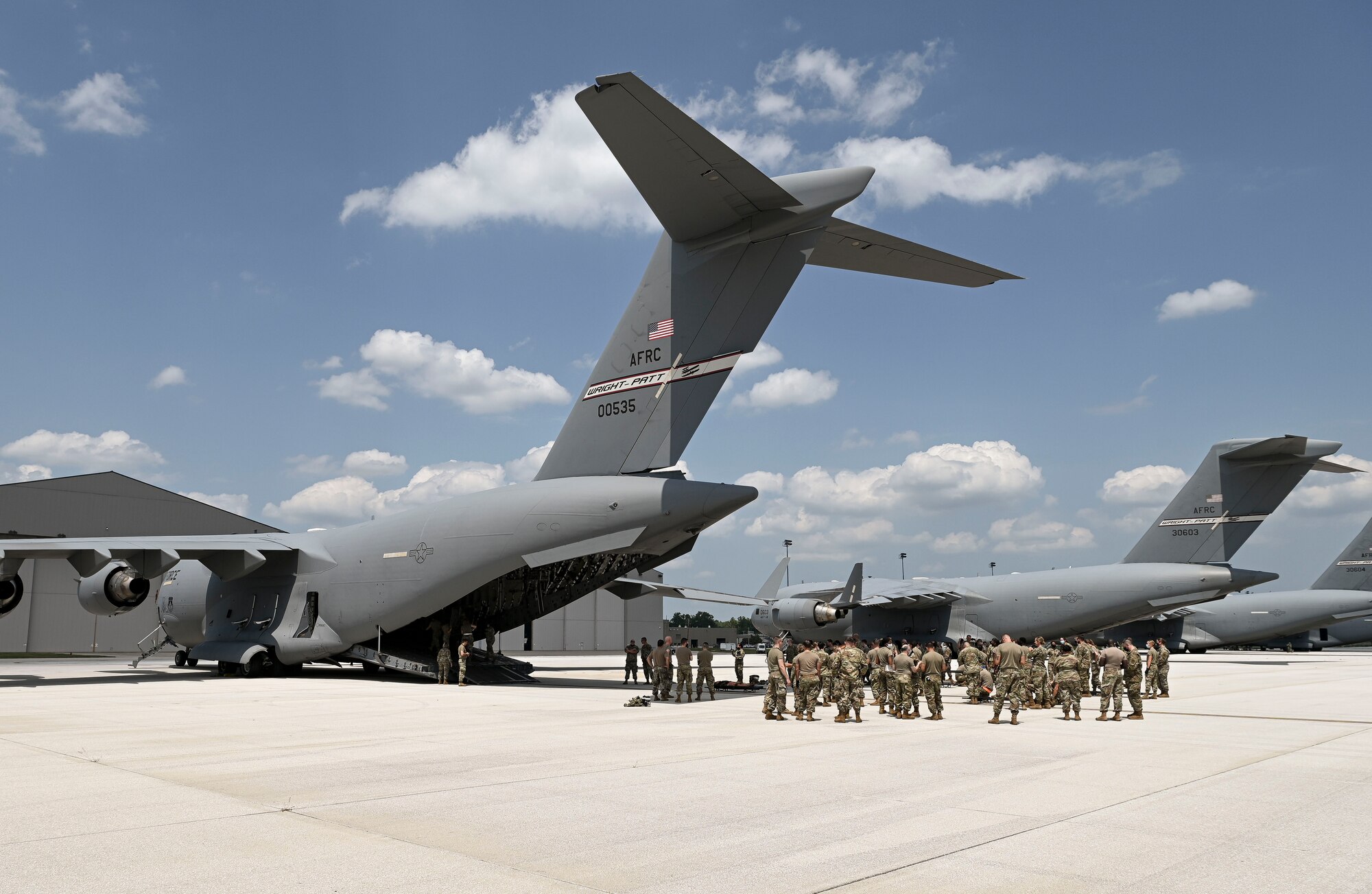 WRIGHT-PATTERSON AFB, OHIO -- U.S. Air Force Reserve Citizen Airmen with the 944th Aeromedical Staging Squadron (ASTS) and the 445th ASTS prepare to conduct aircraft familiarization and En-Route Patient Staging System (ERPSS) training on a C-17 Globemaster III at Wright-Patterson AFB, Ohio, August 5, 2021. The 944th ASTS from Luke AFB, Arizona, aligned their annual training this year with the 445th ASTS to maximize training capabilities by utilizing medical training facilities and ERPSS mission essential squadrons located at Wright-Patterson AFB. (U.S. Air Force photo by Staff Sgt. Matthew Bruch)