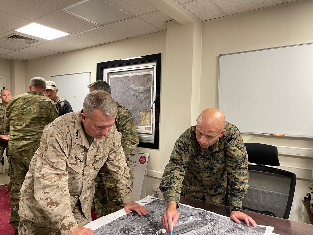 U.S. Marine Corps Gen. Frank McKenzie, the commander of U.S. Central Command, directs operations with U.S. Marine Corps Brig. Gen. Farrell J. Sullivan, the commander of the Naval Amphibious Task Force 51/5th Marine Expeditionary Brigade, at Hamid Karzai International Airport, Afghanistan on August 17, 2021. (U.S. Navy photo by Capt. William Urban)