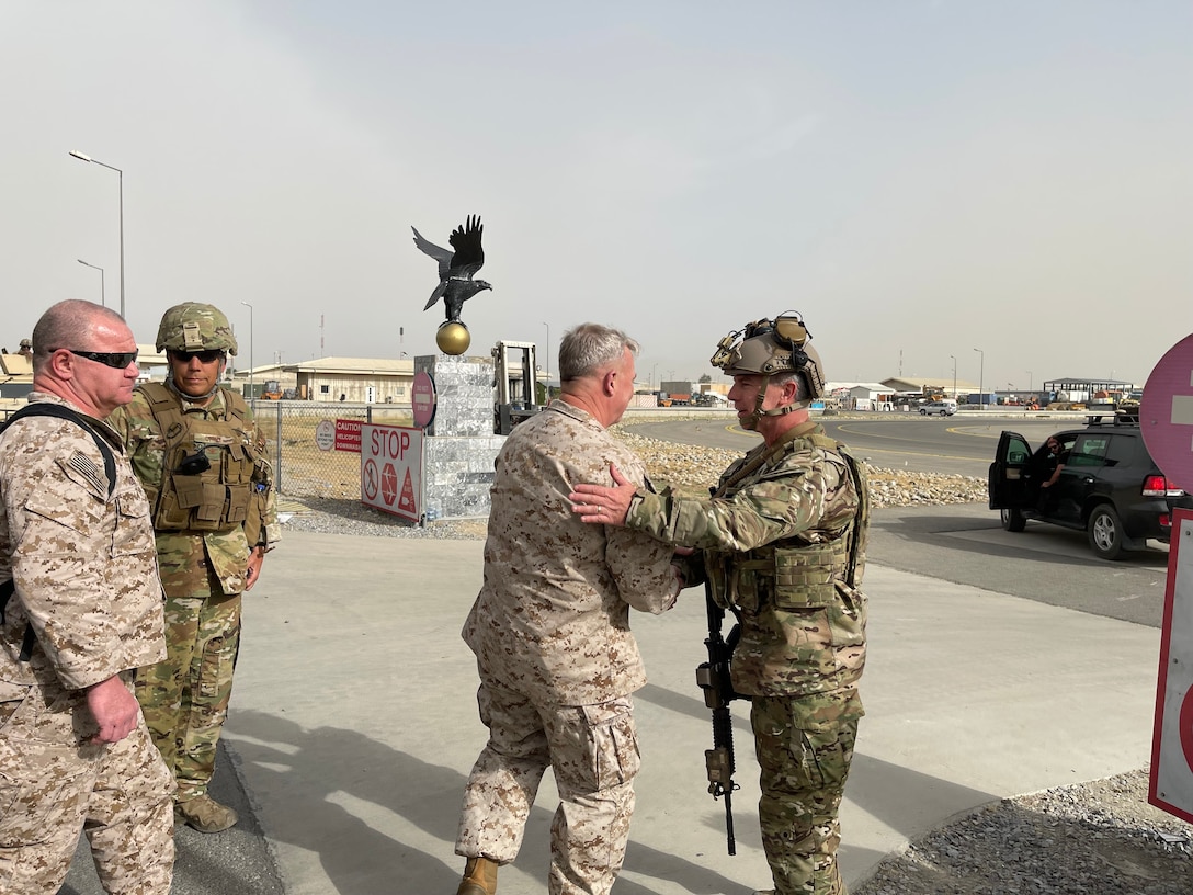 U.S. Marine Corps Gen. Frank McKenzie, the commander of U.S. Central Command, meets with U.S. Navy Rear Adm. Peter Vasely, commander U.S. Forces Afghanistan-Forward, at Hamid Karzai International Airport in Afghanistan. (U.S. Navy photo by Capt. William Urban)