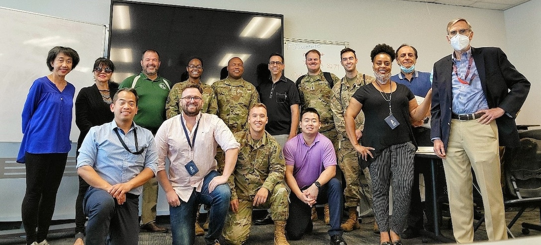 Members of the Space and Missile Systems Center and the National Security Space Institute pose for a group photo upon completion of the Space 100: Space Fundamentals Course at Los Angeles Air Force Base, July 17, 2021. The course, intended for Department of Defense personnel, international partners and U.S. Space Force cadre with limited space operations experience, teaches a basic understanding of space systems and how they support joint military operations. (U.S Space Force photo by Walter Talens)