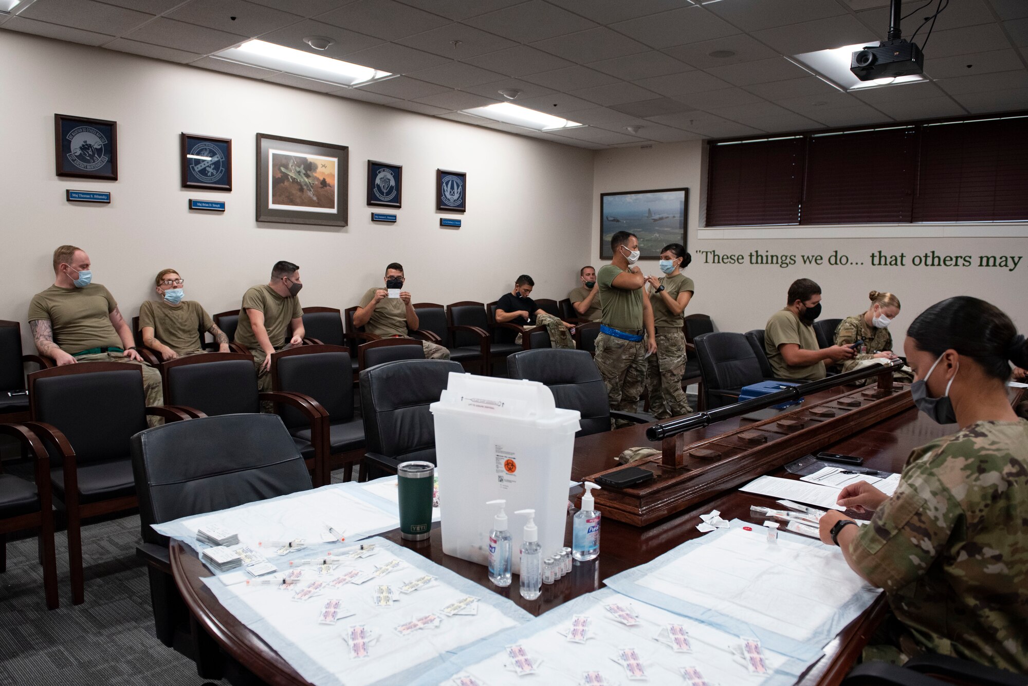 A photo of Airmen waiting to receive vaccines.