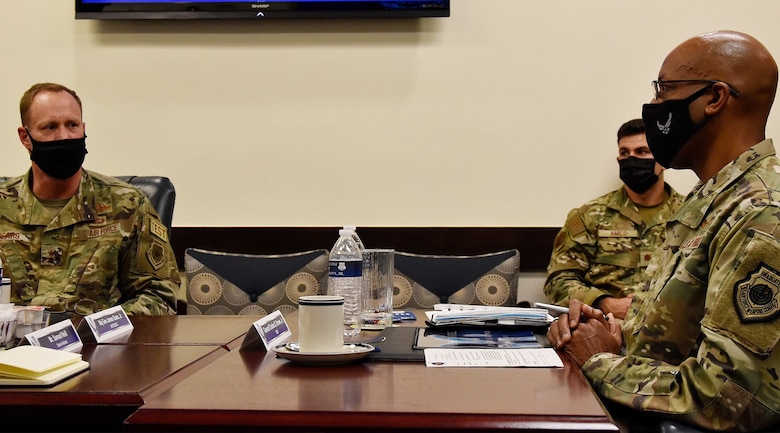 Maj. Gen. James Sears, Air Force Operational Test and Evaluation Center commander, briefs Air Force Chief of Staff Gen. CQ Brown, Jr., about how AFOTEC is meeting the challenge of accelerating change through the test enterprise during CSAF’s visit to the center at Kirtland Air Force Base, N.M., Aug. 12, 2021.