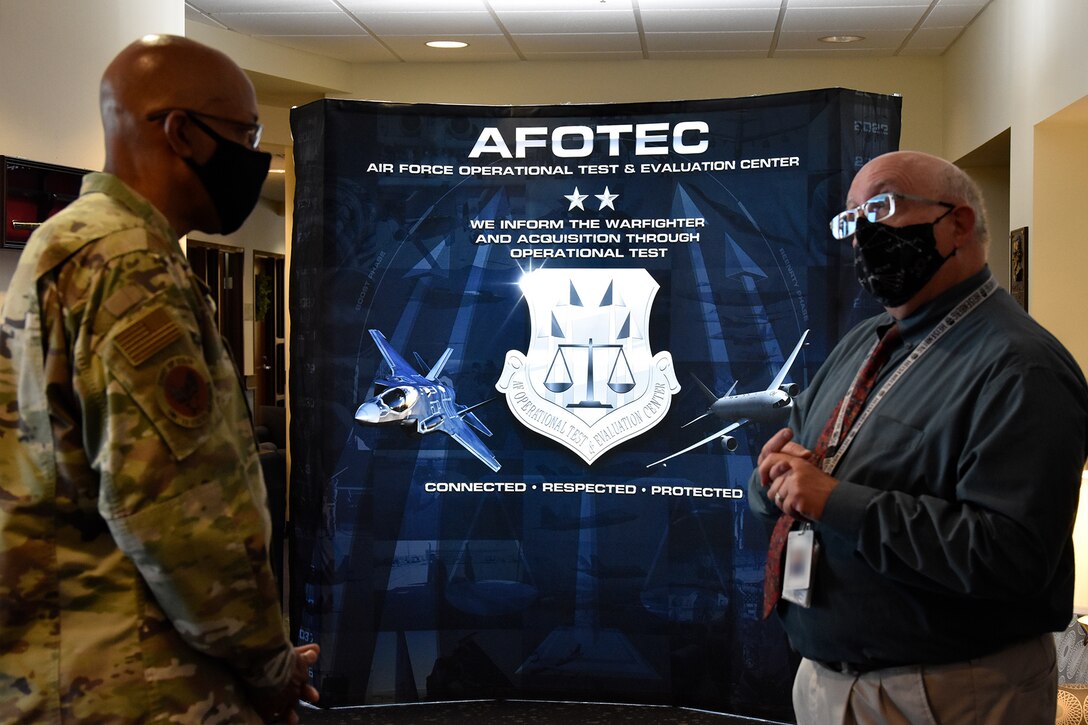 Air Force Chief of Staff Gen. CQ Brown, Jr., talks with Russ Foos, Air Force Operational Test and Evaluation Center training chief, before visiting students at the AFOTEC 301 operational test course that teaches students how to plan, execute, and report operational testing throughout the acquisition of combat capability.