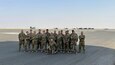 Soldiers assigned to the 82nd Combat Aviation Brigade stand on the flight line at Camp Buehring, Kuwait, July 26, 2021. The 19 Soldiers deployed to Kuwait to provide direct support to the 1100th Theater Aviation Support Maintenance Group and help alleviate a shortage of aviation contractors due to the COVID-19 pandemic. (Courtesy Photo)