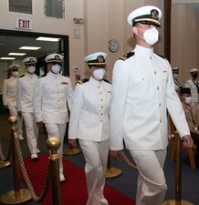 Students assigned to the Naval Chaplaincy School and Center, on Naval Station Newport, R.I., in the Basic Leadership Course, class 21030, march into their graduation ceremony at the Chapel of Hope, Aug. 4. The Basic Leadership Course is a seven-week course which teaches basic knowledge of military chaplaincy as well as the fundamental skills to enable them to function effectively in a variety of sea service venues. (U.S. Navy photo by Mass Communication Specialist 2nd Class Derien C. Luce)