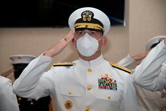 Rear Adm. Gregory Todd, Chaplain of the Marine Corps and Deputy Chief of Chaplains, salutes while the nation anthem plays during a graduation ceremony held in the Chapel of Hope, on Naval Station Newport, R.I., for students assigned to the Naval Chaplaincy School and Center in the Basic Leadership Course, class 21030, Aug. 4. The Basic Leadership Course is a seven-week course which teaches basic knowledge of military chaplaincy as well as the fundamental skills to enable them to function effectively in a variety of sea service venues. (U.S. Navy photo by Mass Communication Specialist 2nd Class Derien C. Luce)