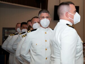 Students assigned to the Naval Chaplaincy School and Center, on Naval Station Newport, R.I., in the Basic Leadership Course, class 21030, line up to receive their certificates during their graduation ceremony at the Chapel of Hope, Aug. 4. The Basic Leadership Course is a seven-week course which teaches basic knowledge of military chaplaincy as well as the fundamental skills to enable them to function effectively in a variety of sea service venues. (U.S. Navy photo by Mass Communication Specialist 2nd Class Derien C. Luce)