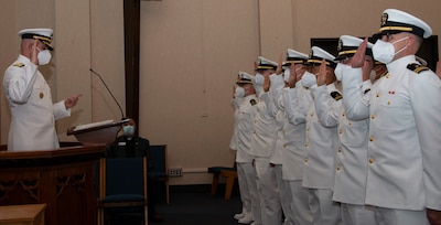 Rear Adm. Gregory Todd, Chaplain of the Marine Corps and Deputy Chief of Chaplains conducts the reaffirmation of commissioning oat during a graduation ceremony held in the Chapel of Hope, on Naval Station Newport, R.I., for students assigned to the Naval Chaplaincy School and Center in the Basic Leadership Course, class 21030, Aug. 4. The Basic Leadership Course is a seven-week course which teaches basic knowledge of military chaplaincy as well as the fundamental skills to enable them to function effectively in a variety of sea service venues. (U.S. Navy photo by Mass Communication Specialist 2nd Class Derien C. Luce)
