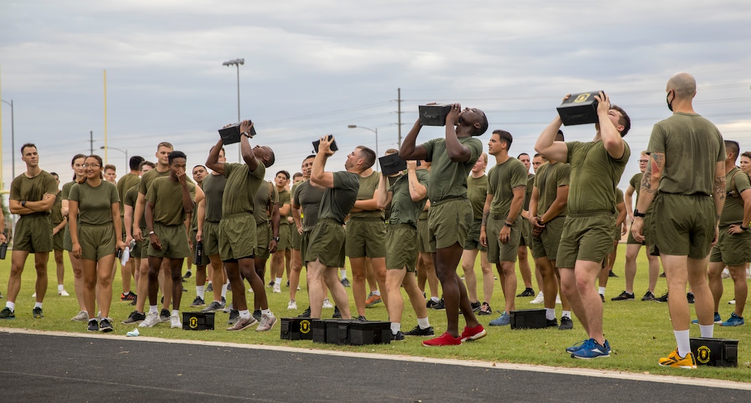 U.S. Marines from Headquarters and Headquarters Squadron (H&HS) participate in a squadron wide physical training (PT) event on Marine Corps Air Station Yuma, Ariz., July 30, 2021.