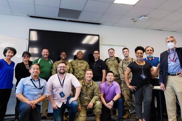 Members of the Space and Missile Systems Center and the National Security Space Institute pose for a group photo upon completion of the Space 100: Space Fundamentals Course at Los Angeles Air Force Base, July 17, 2021. The course, intended for Department of Defense personnel, international partners and U.S. Space Force cadre with limited space operations experience, teaches a basic understanding of space systems and how they support joint military operations. (U.S Space Force photo by Walter Talens)