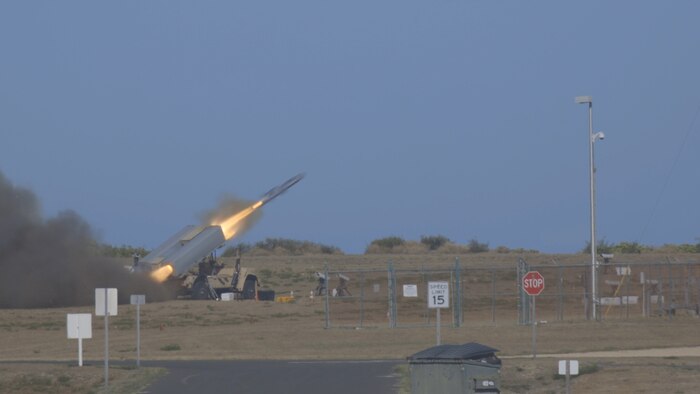 A Naval Strike Missile streaks out to sea before striking a naval target ship, Aug. 15, 2021, aboard Pacific Missile Range Facility Barking Sands, Hawaii. The missile flew more than 100 nautical miles before finding its mark. The live-fire sinking exercise demonstrated a Marine fires expeditionary advanced base’s ability to sense, target and strike a target at sea, providing sea control or contributing to sea denial in fleet operations. The Marine Corps’ Force Design 2030 centers on Marines providing long-range precision strike capabilities as a stand-in force during littoral operations in a contested environment. (U.S. Marine Corps photo by Lance Cpl. Dillon Buck, released)