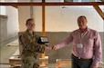 Civil Affairs Team 332 Team Leader Capt. Colleen Cooper presents Red Cross Negotino with a plaque in appreciation for their assistance during a COVID personal protective equipment donation that took place September 16-17, 2020 in vicinity of Negotino and the surrounding villages. Red Cross Negotino is a valuable partner for future projects and support.