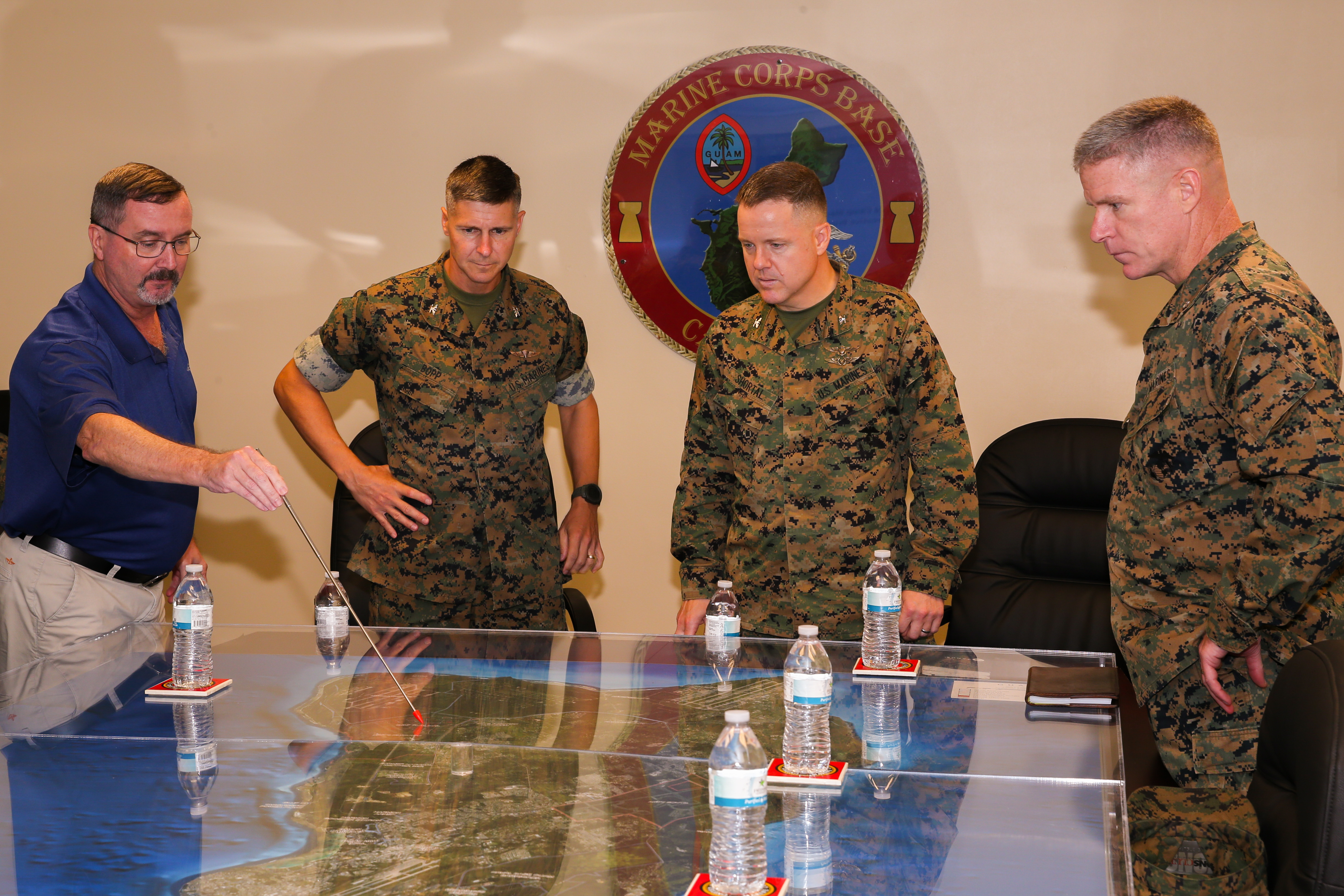 Donald Baldwin, the Marine Corps Base (MCB) Camp Blaz Chief of Staff, left, briefs Col. Matthew C. Shortal, the I Marine Expeditionary Force Forward Coordination Element Chief of Staff, during a visit to MCB Camp Blaz, Aug. 4, 2021.