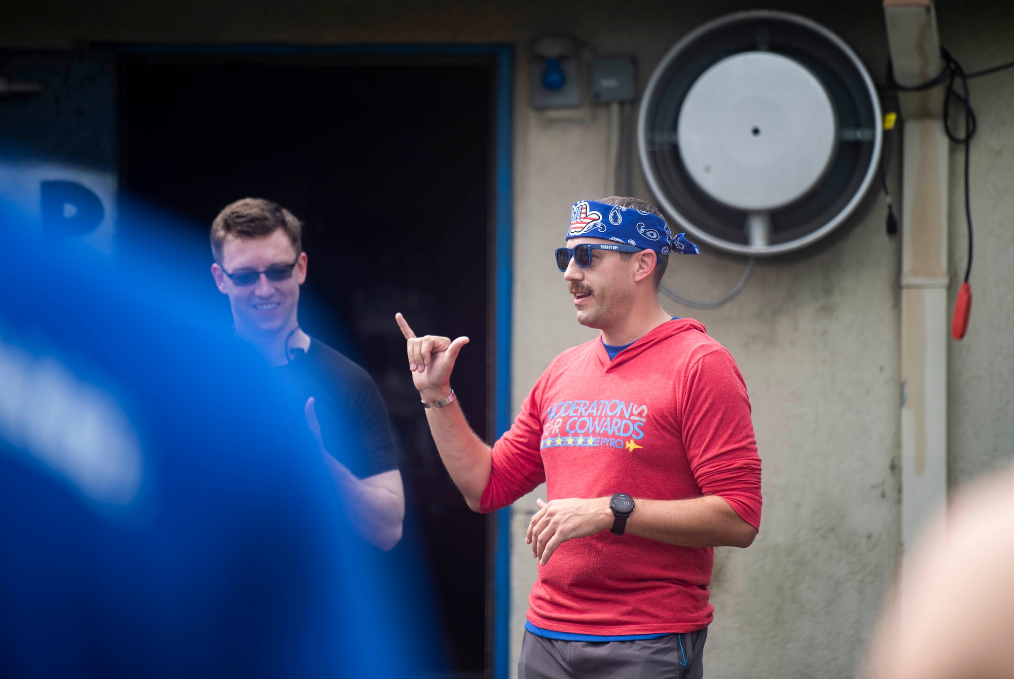 An Airmen speaks during a memorial run.