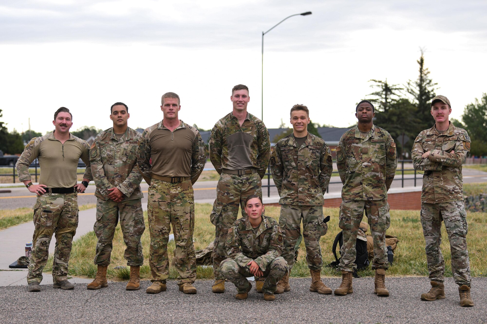 Airmen from the 90th Security Forces Squadron pose for a photo after completing a six-mile ruck during the Global Strike Challenge at F.E. Warren Air Force Base, Wyoming, June 8, 2021. Teams from across Air Force Global Strike Command will compete in events that require physical strength and endurance to prove their capabilities on the team. (U.S. Air Force photo by Airman 1st Class Faith Iris MacIlvaine)