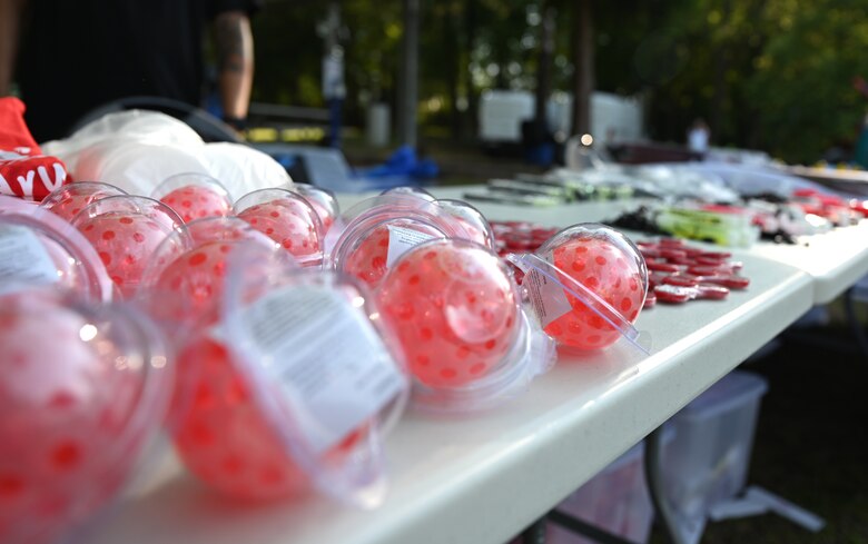 Stress balls sit on a table at the Community Cares Partners Party in the Park event at Vogelweh Military Complex, Germany, Aug. 12, 2021. Helping agencies that support the Kaiserslautern Military Community came to the event to educate people on resources available to them. (U.S. Air Force photo by Senior Airman Thomas Karol)