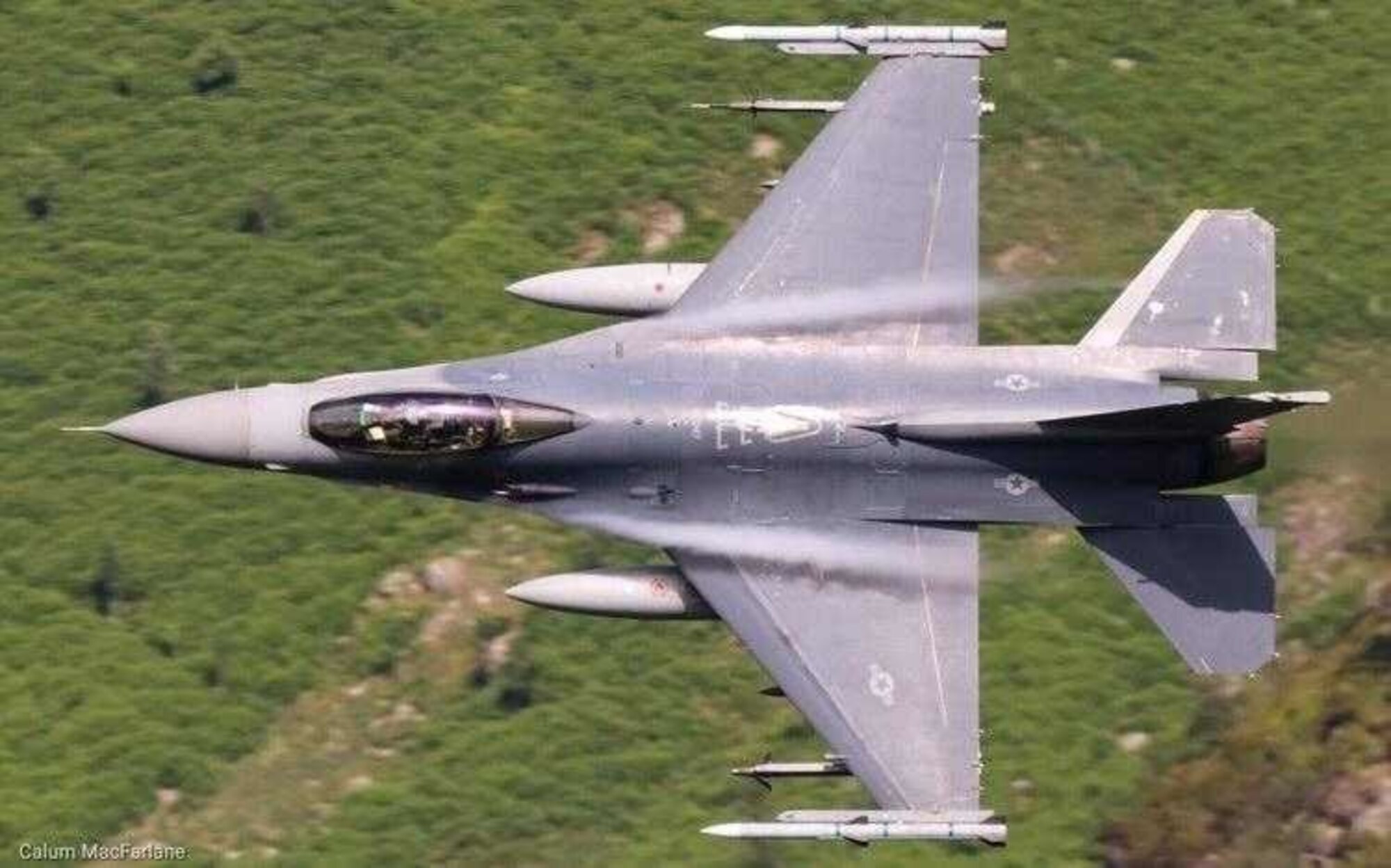A U.S. Air Force F-16 Fighting Falcon assigned to the 31st Fighter Wing participates in a live fire air-to-air missile training employment event in northwestern Wales, July, 2021. The 31st FW F-16s had the opportunity to integrate with F-15E and F-15Cs assigned to Royal Air Force Lakenheath and execute low-level flight training within the United Kingdom environment. (Courtesy photo)