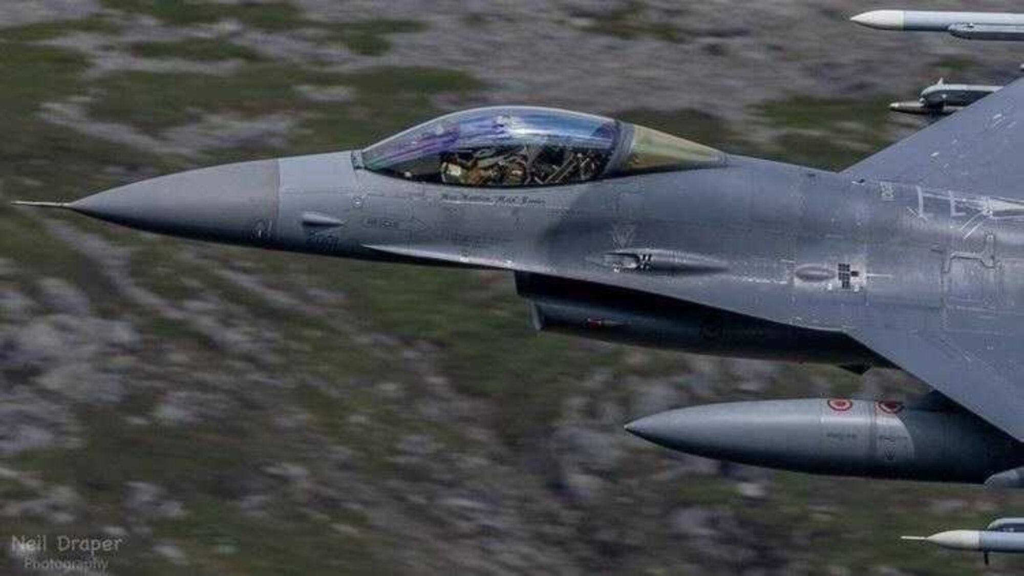 A U.S. Air Force F-16 Fighting Falcon assigned to the 31st Fighter Wing participates in a live fire air-to-air missile training employment event in northwestern Wales, July, 2021. Five F-16s and 36 U.S. Airmen assigned to the 510th Fighter Squadron (FS) and 555th FS conducted live fire air-to-air missile launches with F-15E Strike Eagles from the 494th and 492nd Fighter Squadrons assigned to Royal Air Force (RAF) Lakenheath, England. The training was in coordination with the Aberporth Range Complex in northwestern Wales. (Courtesy Photo)