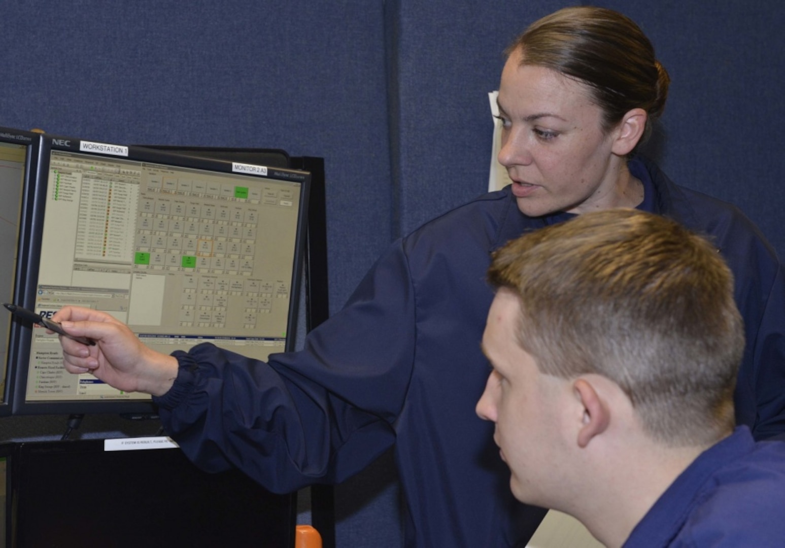 Petty Officer 3rd Class Stephanie Williams and Seaman Thadeus Shudark, both operations specialists, are hard at work in the Sector Hampton Roads Command Center, July 7, 2015. Every day communications watchstanders stand ready for any event.