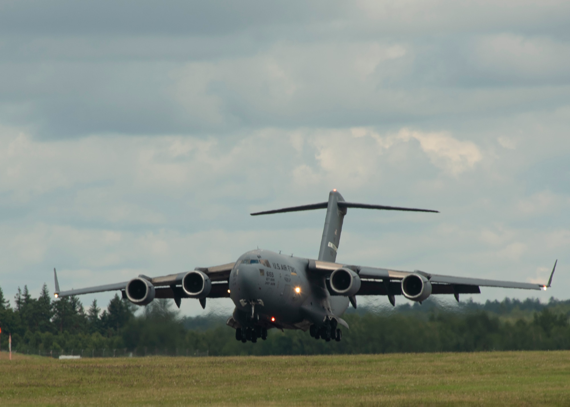 A U.S. Air Force C-17 Globemaster III cargo aircraft lands at Spangdahlem Air Base, Germany, Aug. 5, 2021.
