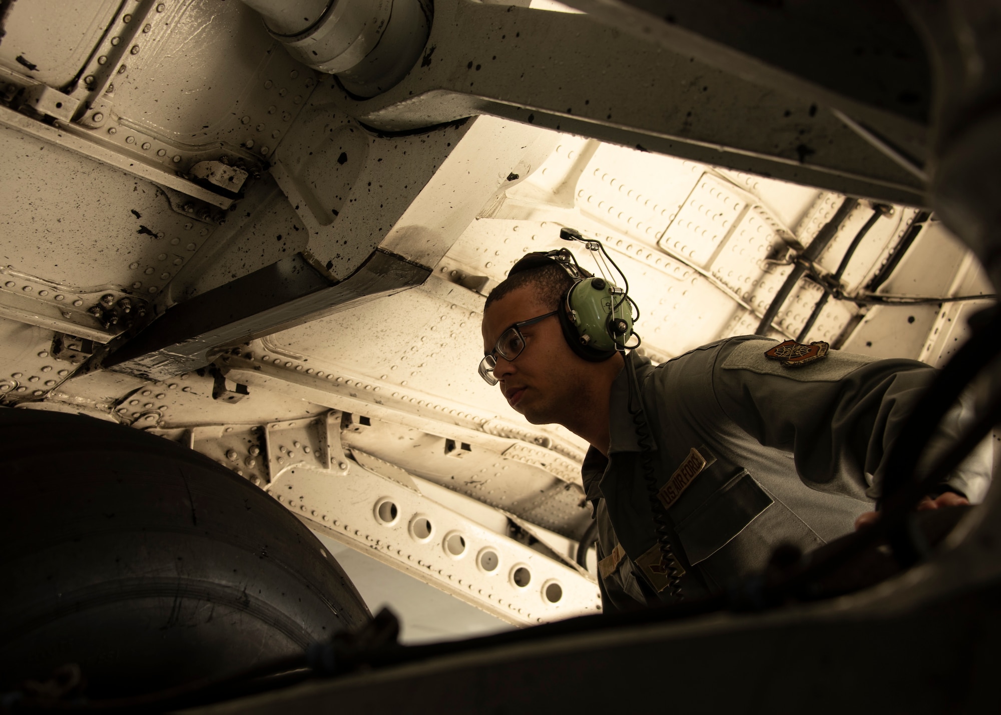 U.S. Air Force Senior Airman Alberto Lara, 726th Aircraft Aerospace Crew Chief, inspects landing gear on a C-17 Globemaster III cargo aircraft on Spangdahlem Air Base, Germany, Aug. 5, 2021.