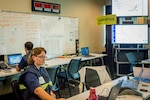 Coast Guard Sector New Orleans command center personnel work to respond to calls from the Baton Rouge flooding in New Orleans, August 17, 2016. The Coast Guard actively coordinated search and rescue cases for people in distress.