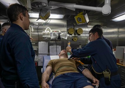 210722-N-KY668-1262 CARIBBEAN SEA - (July 22, 2021) – Hospital Corpsman 1st Class James P. McHale leads a medical training drill in the medical treatment room aboard the Freedom-variant littoral combat ship USS Billings (LCS 15), July 22, 2021. Billings is deployed to the U.S. 4th Fleet area of operations to support Joint Interagency Task Force South’s mission, which includes counter-illicit drug trafficking missions in the Caribbean and Eastern Pacific. (U.S. Navy photo by Mass Communication Specialist 2nd Class Austin G. Collins/Released)