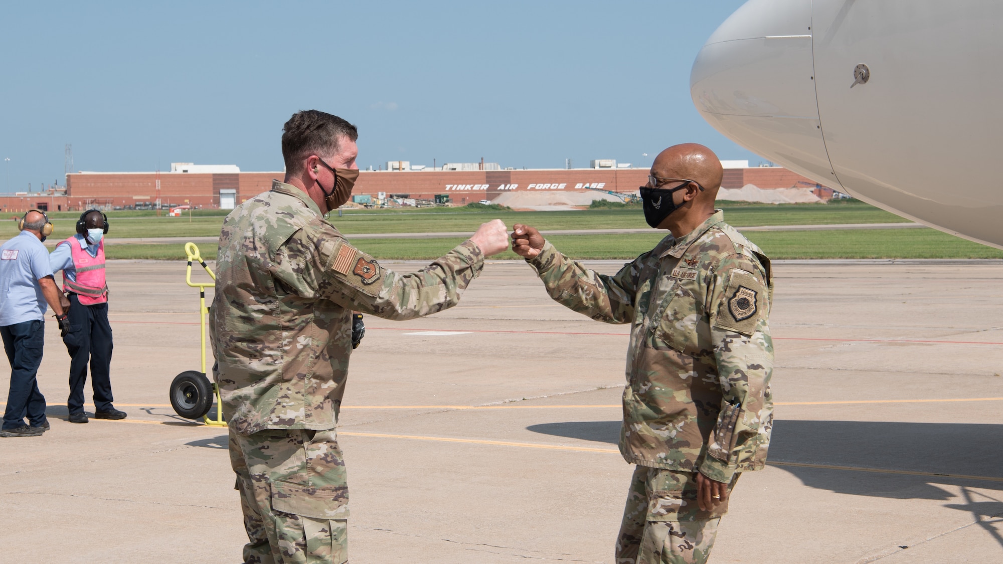 Men fist bumping