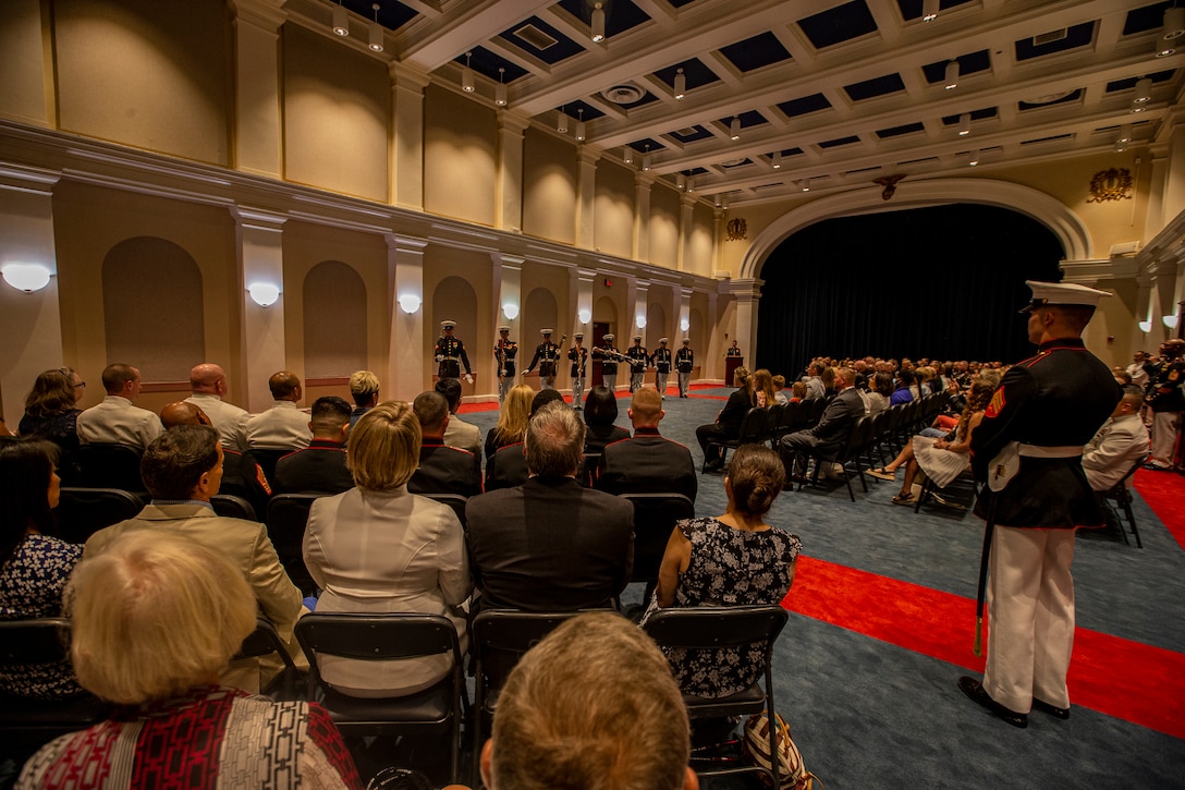 Marines with the Silent Drill Platoon perform during the Friday Evening Parade at Marine Barracks Washington, Aug. 13, 2021. The hosting official for the evening was the 19th Sergeant Major of the Marine Corps, Sgt. Maj. Troy E. Black, and the guests of honor were former Sergeants Major of the Marine Corps, Sergeants Maj. Alford L. McMichael, John L. Estrada, Michael P. Barrett, and Ronald L. Green. (U.S. Marine Corps photo by Lance Cpl. Mark Morales)