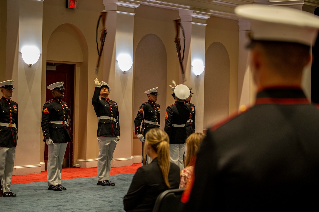 Marines with the Silent Drill Platoon execute their “rifle inspection” during the Friday Evening Parade at Marine Barracks Washington, August 13, 2021. The hosting official for the evening was the 19th Sergeant Major of the Marine Corps, Sgt. Maj. Troy E. Black, and the guests of honor were former Sergeants Major of the Marine Corps, Sergeants Maj. Alford L. McMichael, John L. Estrada, Michael P. Barrett, and Ronald L. Green. (U.S. Marine Corps photo by Lance Cpl. Mark Morales)