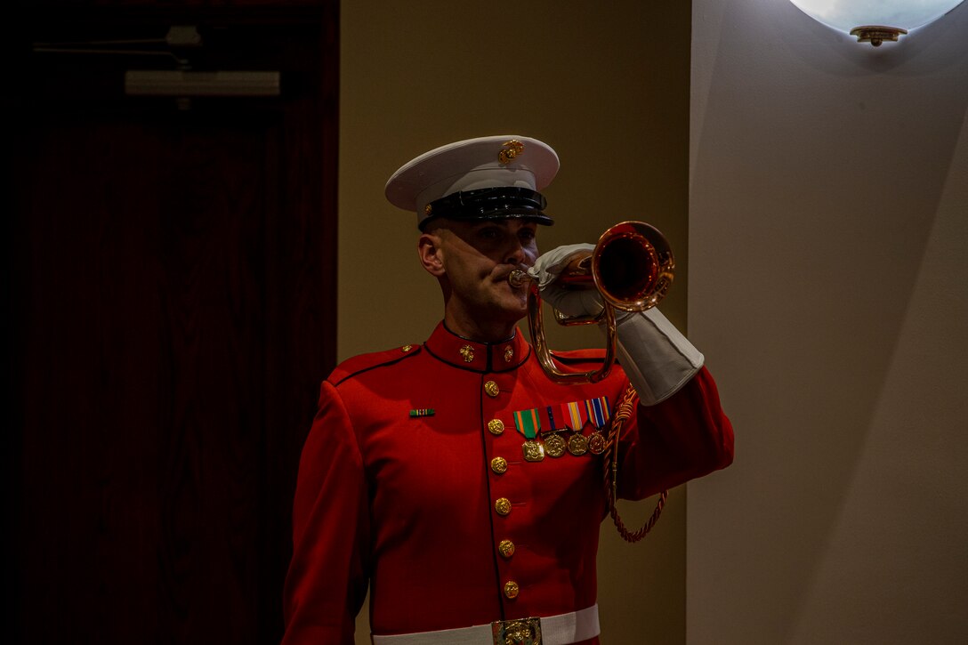 Staff Sgt. Christopher Walker, ceremonial bugler with “The Commandant’s Own,” U.S. Marine Drum and Bugle Corps, plays “Taps” during the Friday Evening Parade at Marine Barracks Washington, Aug. 13, 2021. The hosting official for the evening was the 19th Sergeant Major of the Marine Corps, Sgt. Maj. Troy E. Black, and the guests of honor were former Sergeants Major of the Marine Corps, Sergeants Maj. Alford L. McMichael, John L. Estrada, Michael P. Barrett, and Ronald L. Green. (U.S. Marine Corps photo by Lance Cpl. Mark Morales)