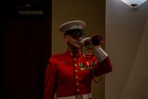 Staff Sgt. Christopher Walker, ceremonial bugler with “The Commandant’s Own,” U.S. Marine Drum and Bugle Corps, plays “Taps” during the Friday Evening Parade at Marine Barracks Washington, Aug. 13, 2021.