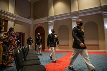 Honorees walk to their seats during the Brigadier General Select Orientation Course Honors Ceremony at Marine Barracks Washington, Aug. 16, 2021.